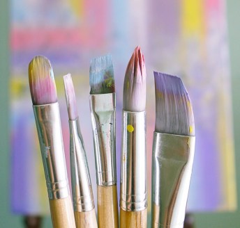 shallow focus photo of paint brushes